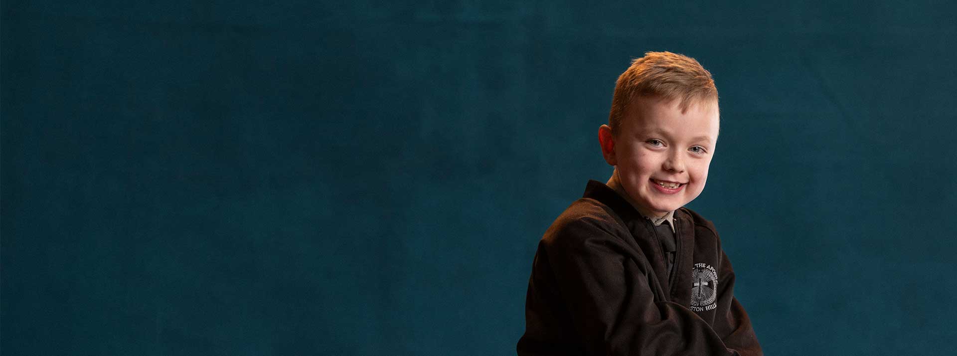 St Paul the Apostle Primary School Winston Hills student. The student is smiling towards the camera.