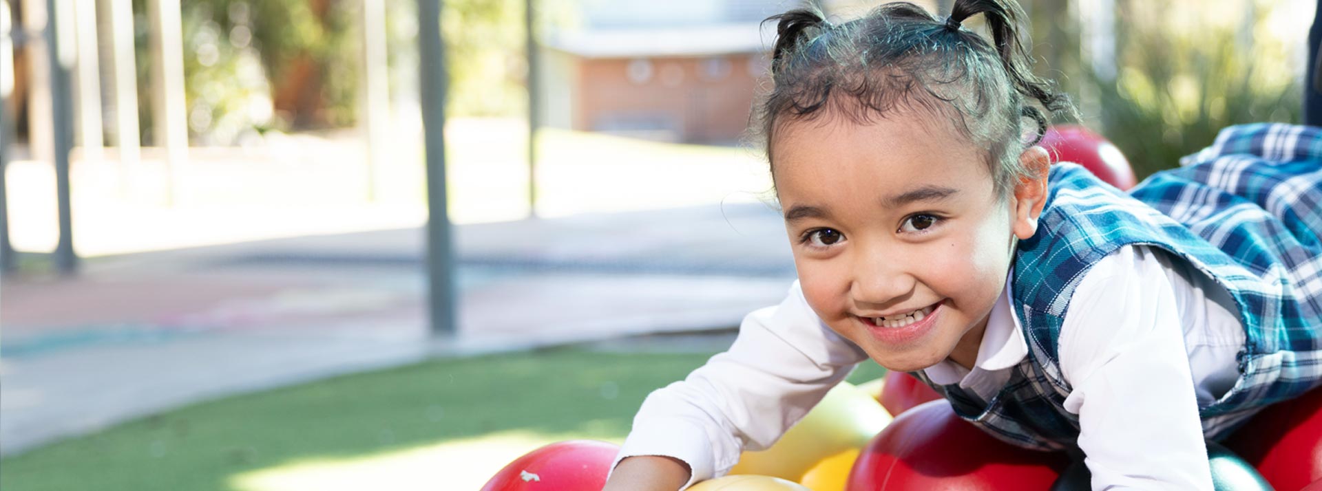 Holy Family Primary Emerton student on playground equipment