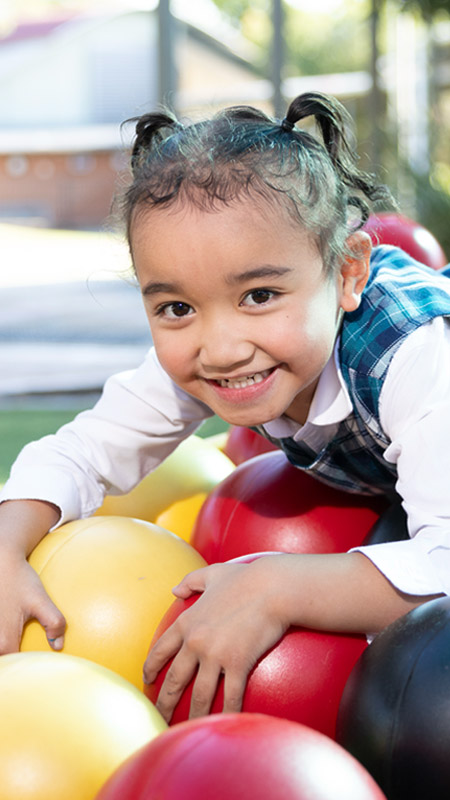 Holy Family Primary Emerton student on playground equipment