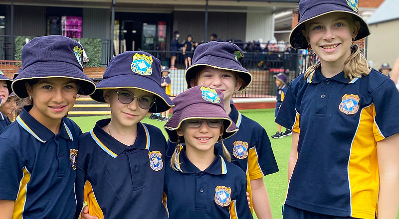 St Matthew's Catholic Primary School Windsor students in outdoor setting. They are wearing the sports uniform