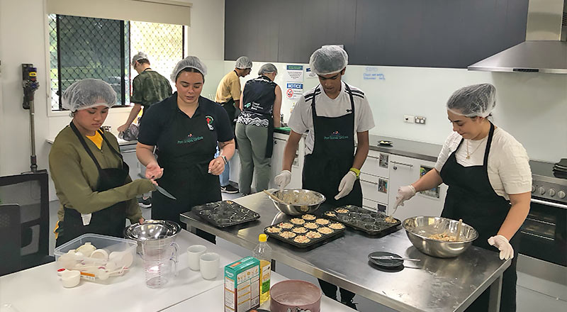 Students engaged in hospitality training program at the Aengus Kavanagh Education and Equity Centre in Mount Druitt