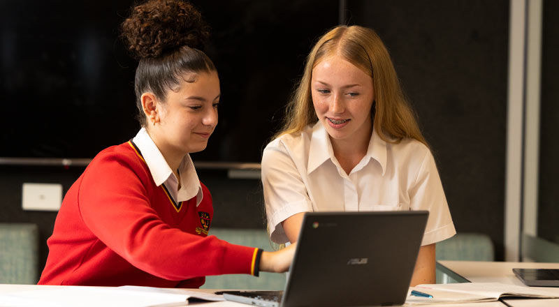 St Clare's Hassall Grove students working off of laptop