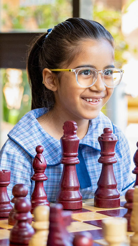 St John Vianney's Primary Doonside student playing chess
