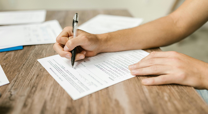 CSPD family filling out an Aboriginal and Torres Strait Islander Student School Fee Offering Form