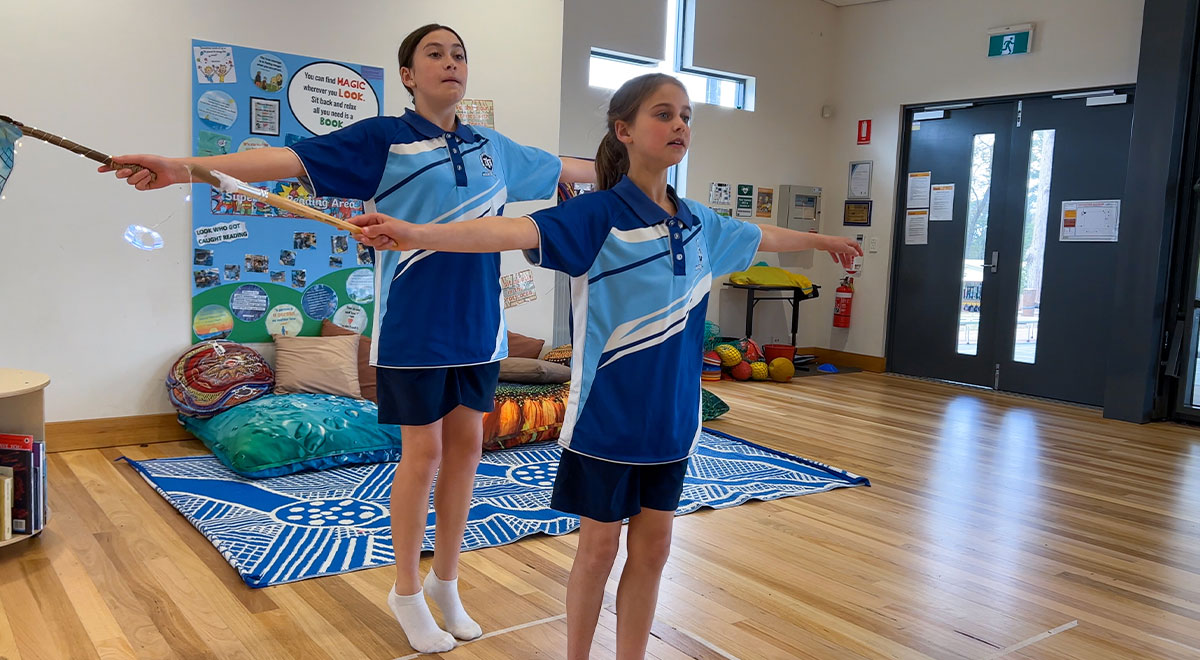 Students from St Thomas Aquinas Primary Springwood practising the Dragonfly Dance which they will present at the conference.