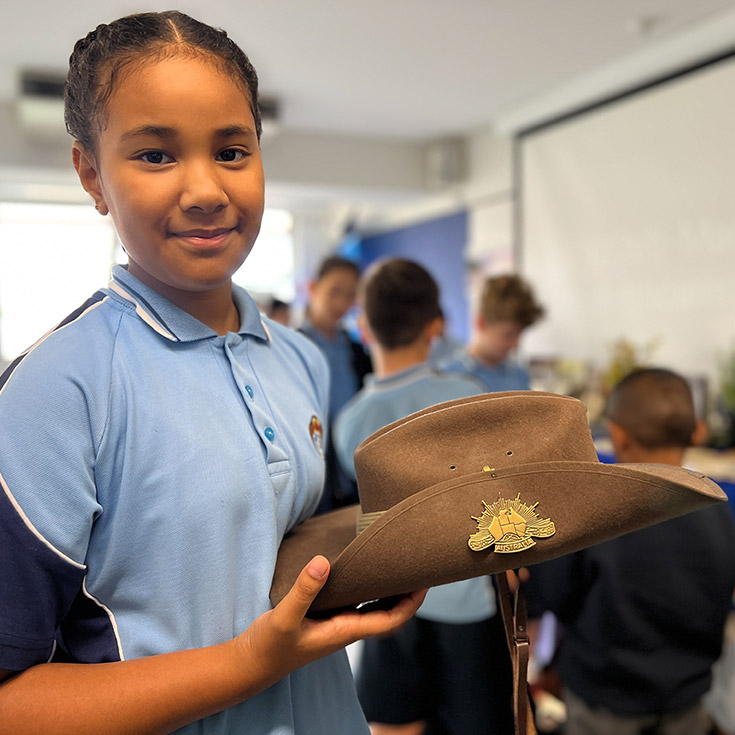 St Margaret Mary's Primary Merrylands student with ANZAC Day memento