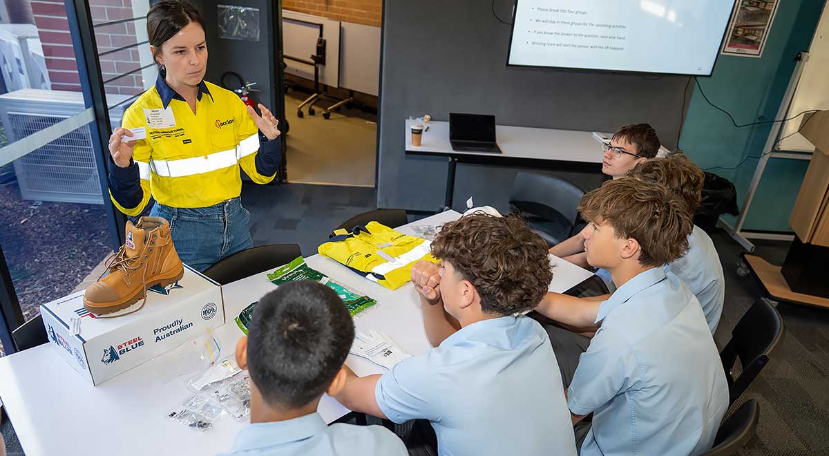 Jessica Wilcox, ACCIONA, showing  Penola Catholic College Students the proper work attire